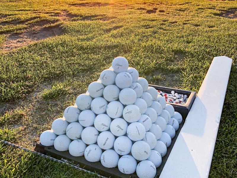 Golf balls and equipment for training programs